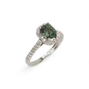 Platinum green sapphire halo ring