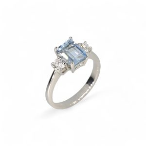 Platinum aquamarine and diamond three stone