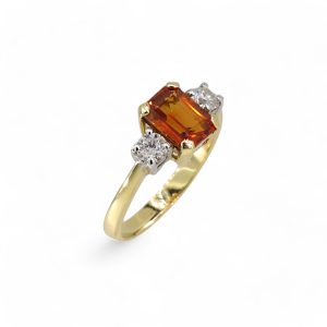 18ct yellow gold orange sapphire and diamond three stone
