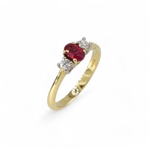 18ct yellow gold oval cut ruby and diamond three stone