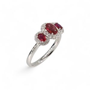 Platinum ruby and diamond halo three stone