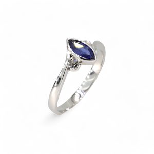 Platinum rub over marquise sapphire and diamond three stone