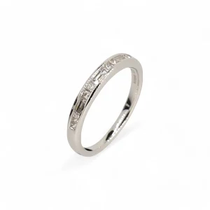Platinum princess and baguette cut diamond band