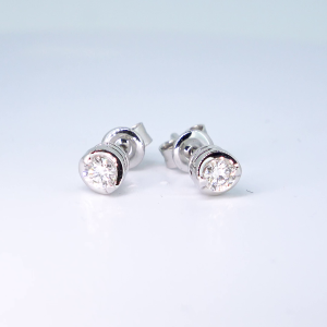 18ct white gold 0.15ct rub over diamond earrings.